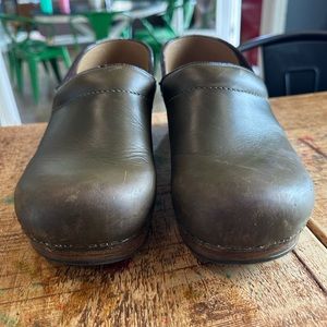 Olive green Dansko clogs. Used but sole and and bottom in excellent condition